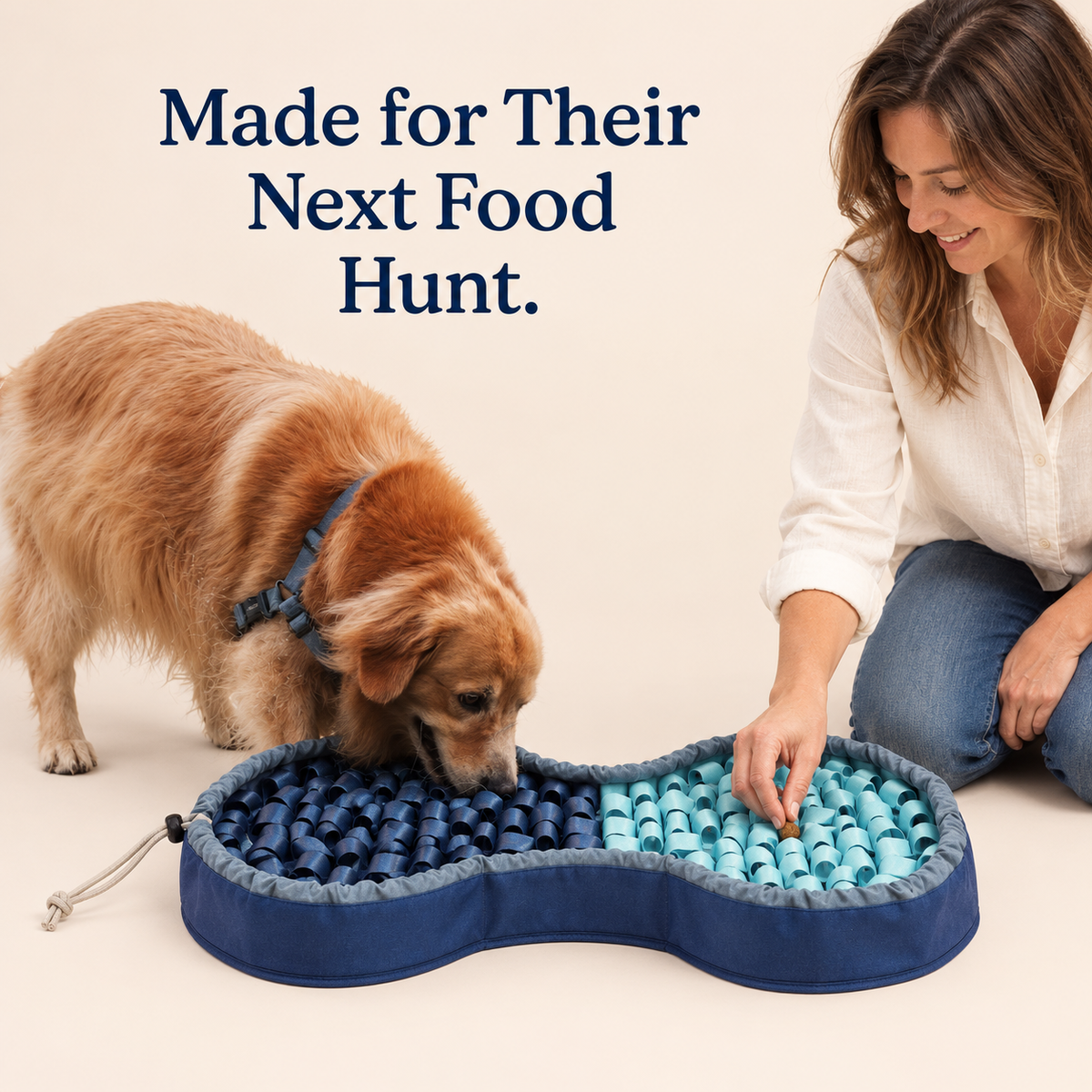 Dog sniffing the raised blue SmartMat as a woman hides a small food bite